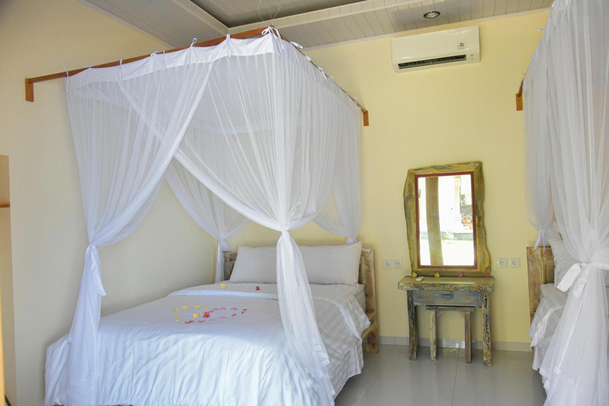 Ganesha Amed Hotell Rum bild